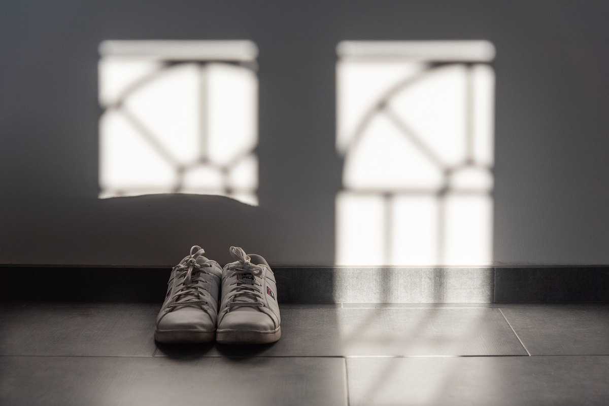 A pair of replica sneakers on the hallway