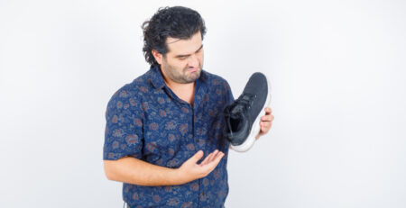 A guy inspecting a rep shoe