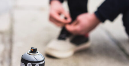 A guy tying his shoe